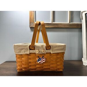 Longaberger picnic basket with double swing handles and cream fabric liner with
